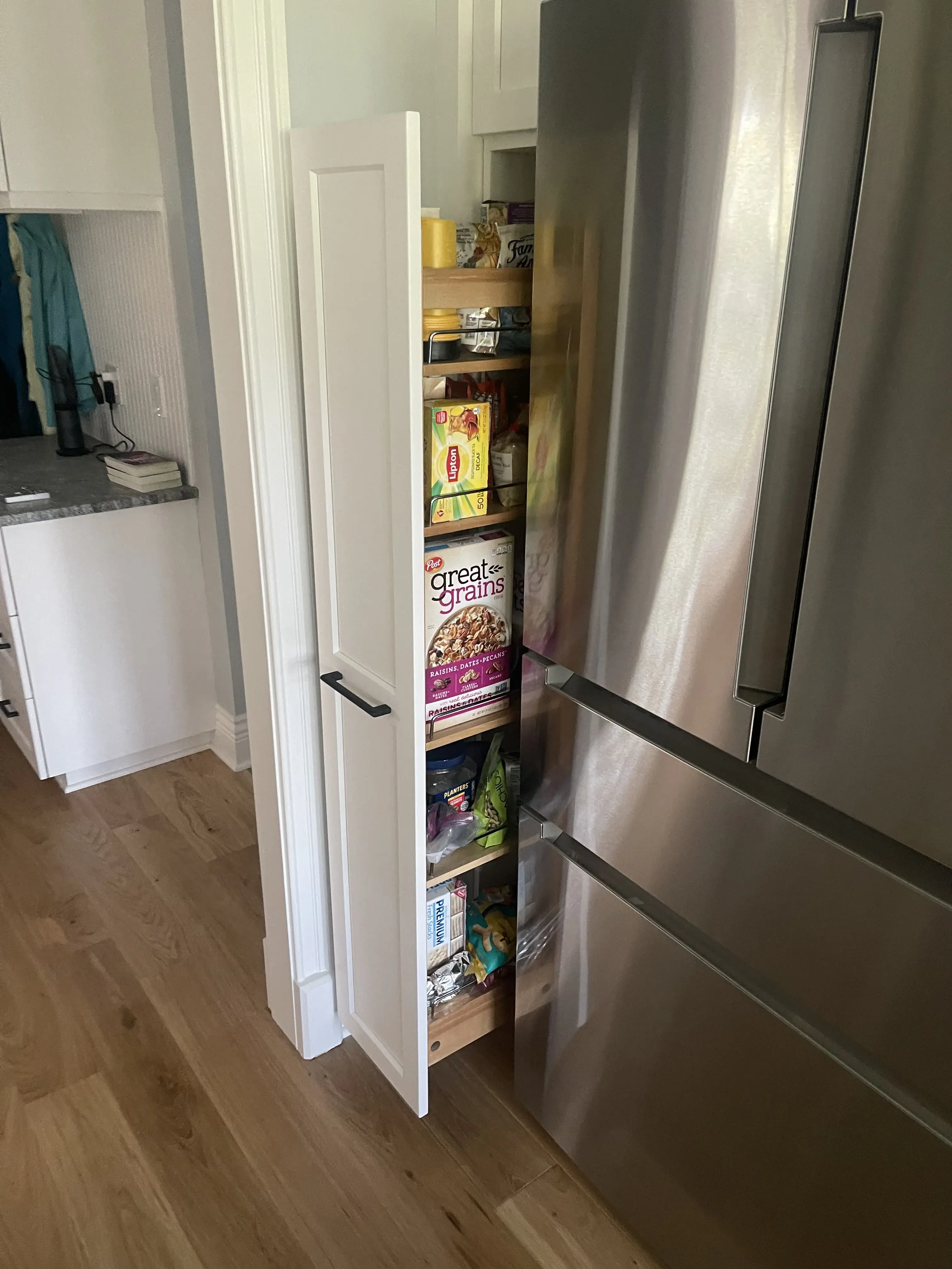 Pull Out Kitchen Pantry Cabinet Open by Bleu Ribbon Design & Remodeling